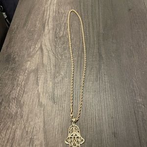 Hamsa gold necklace.